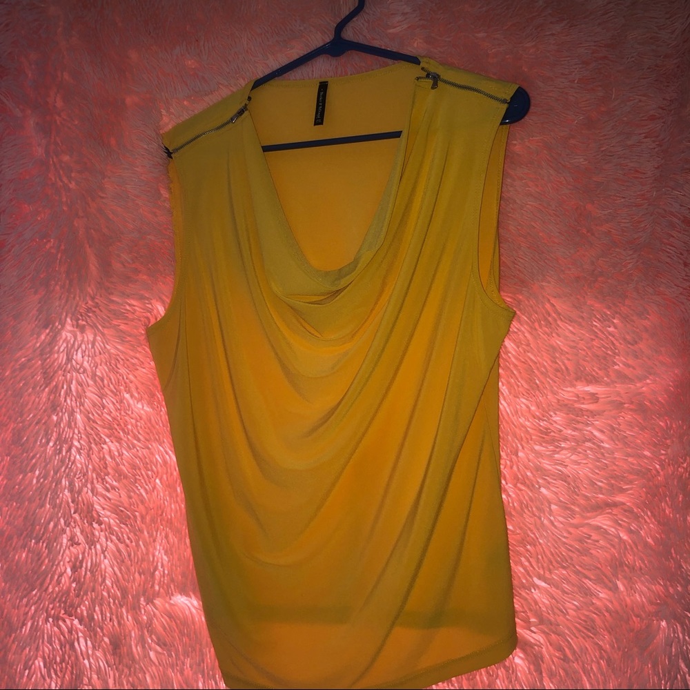 Yellow shirt with zippers on shoulders